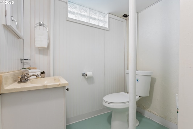 bathroom featuring toilet and vanity
