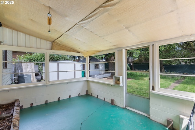 unfurnished sunroom with lofted ceiling