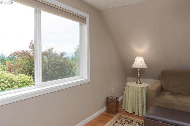 sitting room with healthy amount of natural light, light wood-style flooring, and baseboards