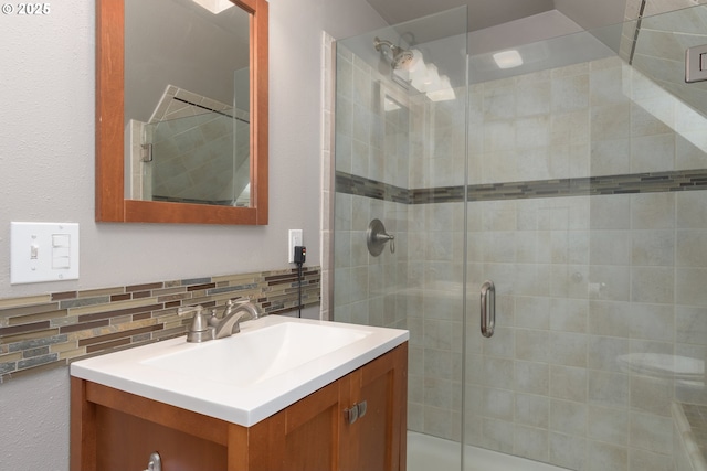 bathroom featuring vanity and a stall shower