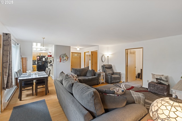 9 N 20th St, Hood River, OR 97031 - living area with a baseboard heating unit and light wood-style flooring