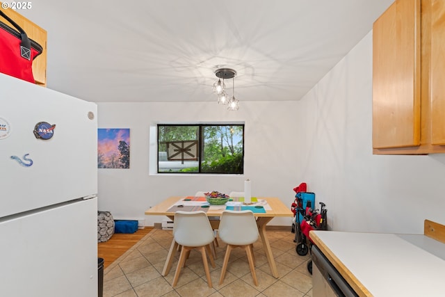 9 N 20th St, Hood River, OR 97031 - dining space featuring light tile patterned floors and a baseboard heating unit