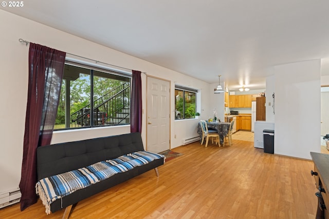 9 N 20th St, Hood River, OR 97031 - foyer entrance featuring light wood-style floors and a baseboard radiator