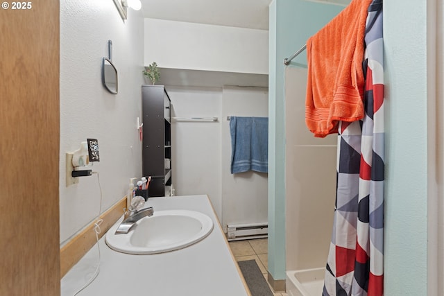 9 N 20th St, Hood River, OR 97031 - full bathroom featuring a baseboard radiator, a shower with curtain, tile patterned flooring, and vanity