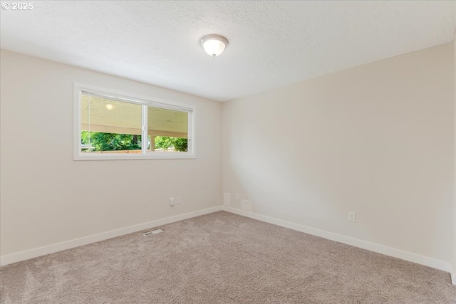 180 Nelson Ln, Gladstone, OR 97027 - carpeted empty room featuring baseboards and a textured ceiling