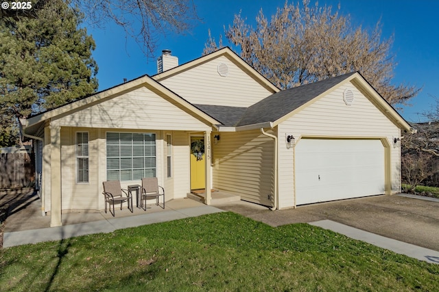 view of front facade with a front lawn and a garage