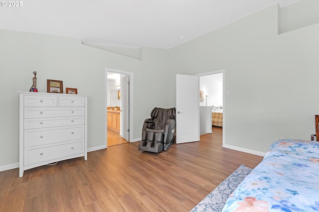 16085 SW Towhee Ln, Beaverton, OR 97007 - bedroom with baseboards, wood finished floors, and ensuite bathroom