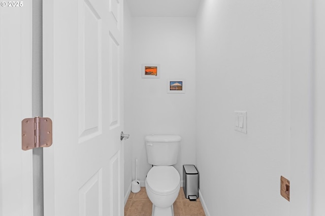 16085 SW Towhee Ln, Beaverton, OR 97007 - bathroom featuring tile patterned floors, toilet, and baseboards