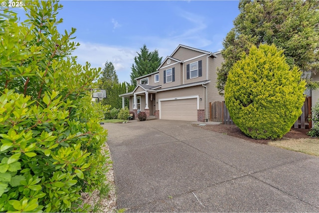 16085 SW Towhee Ln, Beaverton, OR 97007 - view of front of property featuring brick siding, a garage, and driveway