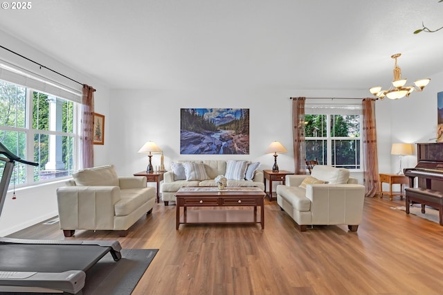 16085 SW Towhee Ln, Beaverton, OR 97007 - living area featuring wood finished floors and a chandelier