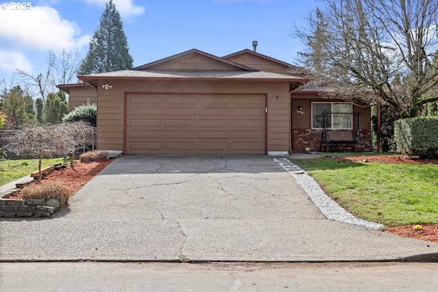 ranch-style home with a garage and driveway