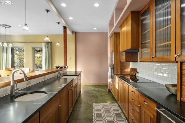 625 Columbia Ave, Lyle, WA 98635 - kitchen with brown cabinetry, a sink, baseboards, recessed lighting, and decorative backsplash