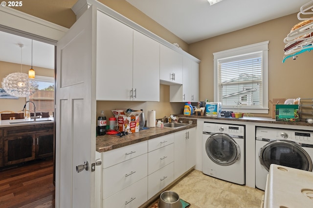 laundry area with washer and dryer and cabinet space