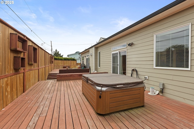 deck with a hot tub