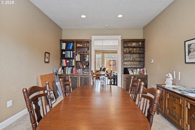 dining room featuring carpet floors, baseboards, and recessed lighting