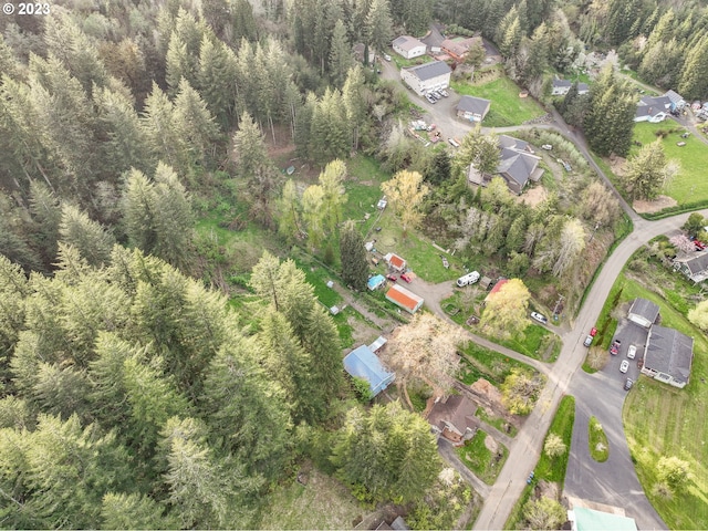 bird's eye view featuring a wooded view