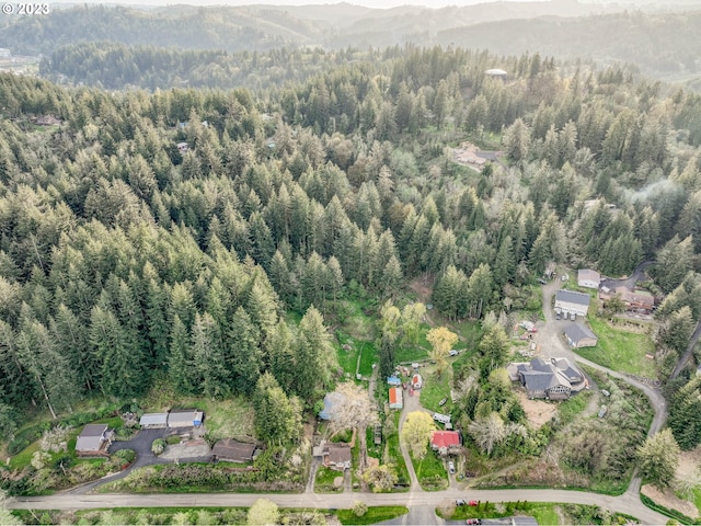 aerial view with a view of trees and a mountain view