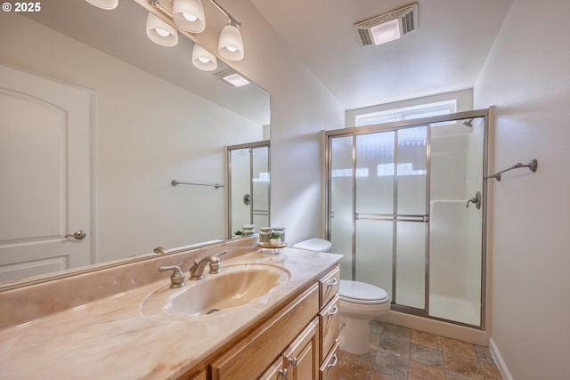 1587 NW 39th St, Lincoln City, OR 97367 - bathroom featuring visible vents, a stall shower, stone finish floor, and vanity