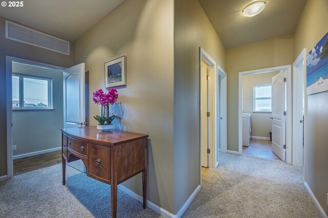 1587 NW 39th St, Lincoln City, OR 97367 - hallway featuring carpet floors, baseboards, and visible vents