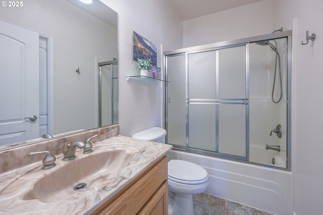 1587 NW 39th St, Lincoln City, OR 97367 - full bath with vanity, bath / shower combo with glass door, stone finish flooring, and toilet