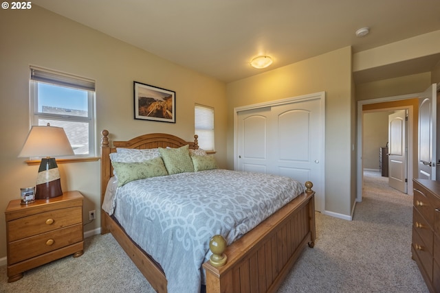 1587 NW 39th St, Lincoln City, OR 97367 - bedroom featuring baseboards, light carpet, and a closet