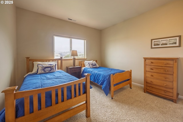 1587 NW 39th St, Lincoln City, OR 97367 - bedroom featuring baseboards, visible vents, and light carpet