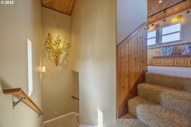 1587 NW 39th St, Lincoln City, OR 97367 - staircase featuring carpet flooring, baseboards, wood ceiling, and a towering ceiling