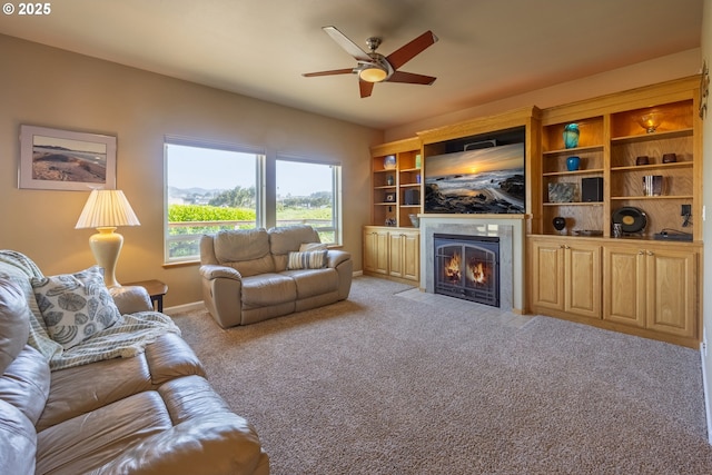 1587 NW 39th St, Lincoln City, OR 97367 - living area featuring a ceiling fan, baseboards, light carpet, and a tile fireplace