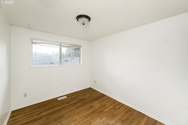 730 SW Dolph St, Portland, OR 97219 - unfurnished room with wood finished floors and a textured ceiling