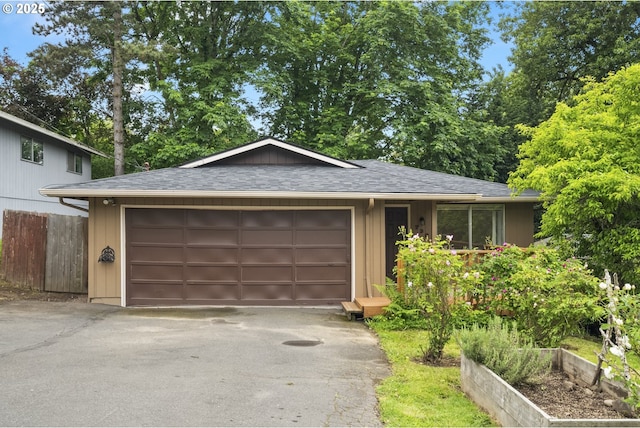 730 SW Dolph St, Portland, OR 97219 - view of front of property featuring asphalt driveway, a shingled roof, and an attached garage