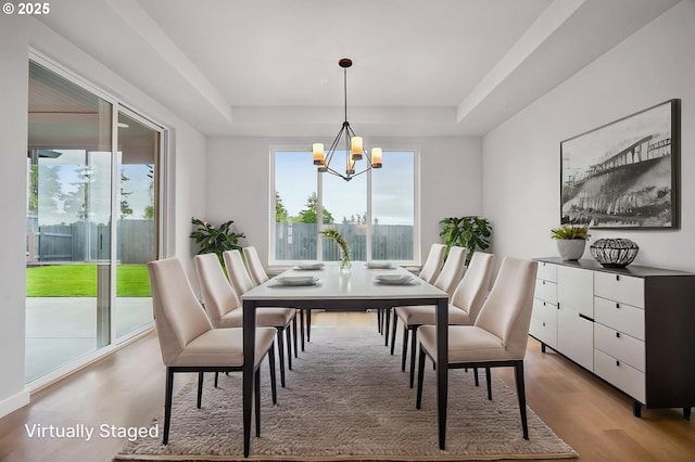 4321 N 11th Way, Ridgefield, WA 98642 - dining room featuring a tray ceiling, a chandelier, and light wood-style floors