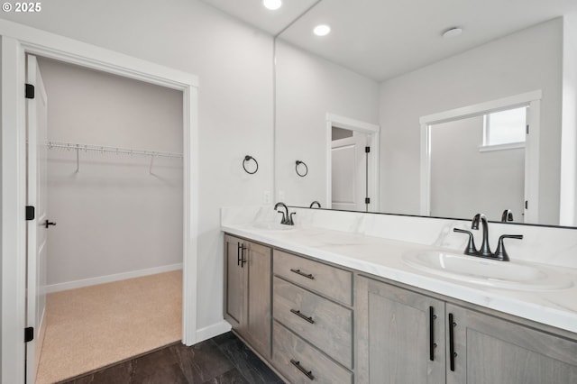 4321 N 11th Way, Ridgefield, WA 98642 - full bathroom with a spacious closet, double vanity, baseboards, and recessed lighting