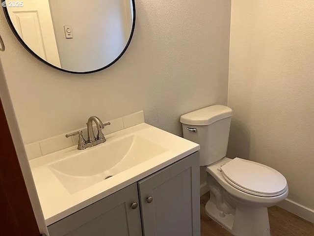 6125 S Hood Ave, Portland, OR 97239 - half bath with toilet, wood finished floors, and vanity