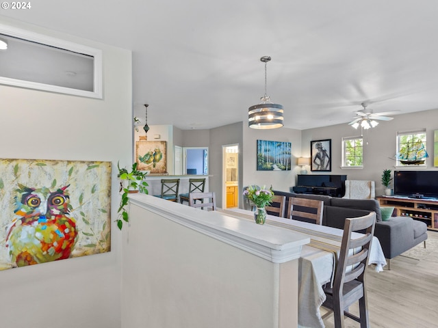 1170 NE 64th Ln Unit 1209, Hillsboro, OR 97124 - dining space with light wood-type flooring and ceiling fan