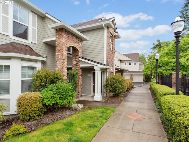 exterior space with brick siding and fence