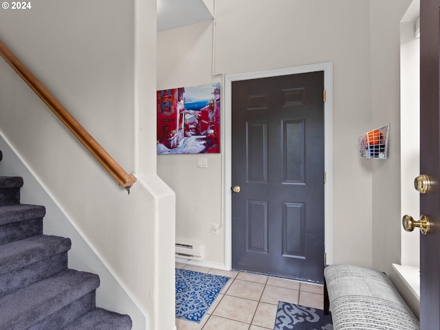 1170 NE 64th Ln Unit 1209, Hillsboro, OR 97124 - entrance foyer featuring a baseboard radiator, light tile patterned floors, and stairway