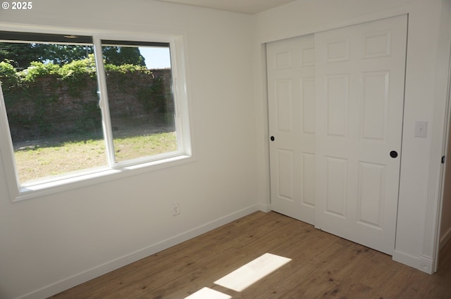 7012 NE 149th Ct, Vancouver, WA 98682 - unfurnished bedroom featuring baseboards, wood finished floors, and a closet