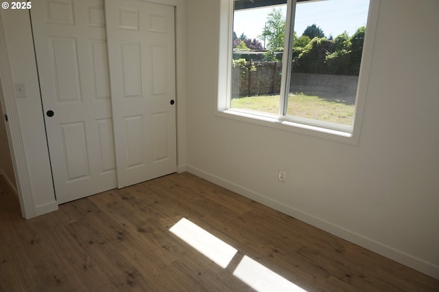 7012 NE 149th Ct, Vancouver, WA 98682 - unfurnished bedroom featuring baseboards, wood finished floors, and a closet