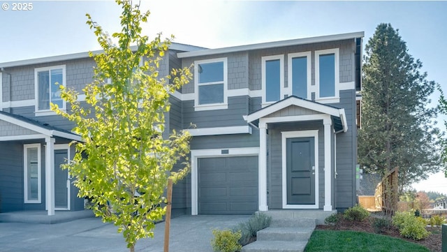 view of front of house with a garage and concrete driveway