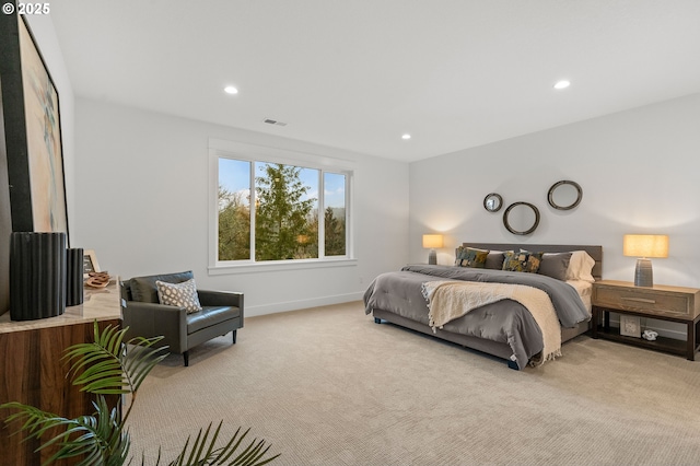 bedroom with light colored carpet