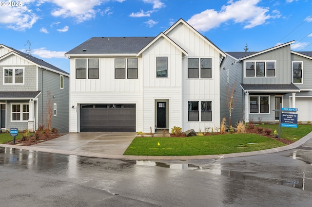 view of front of home featuring a garage and a front yard