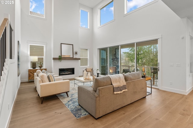 living room with plenty of natural light and light wood-type flooring