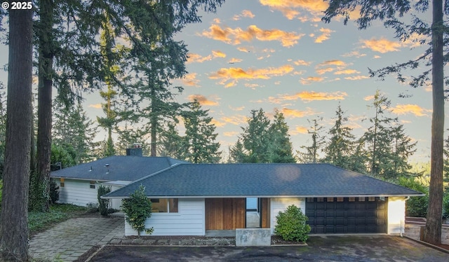 ranch-style home featuring a garage