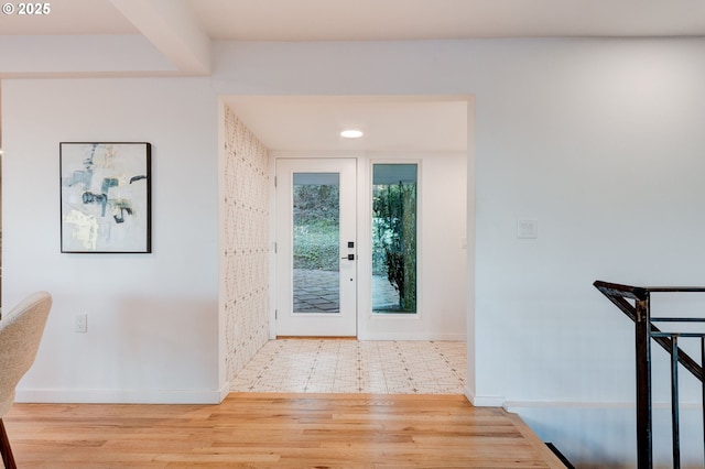 foyer entrance with hardwood / wood-style floors