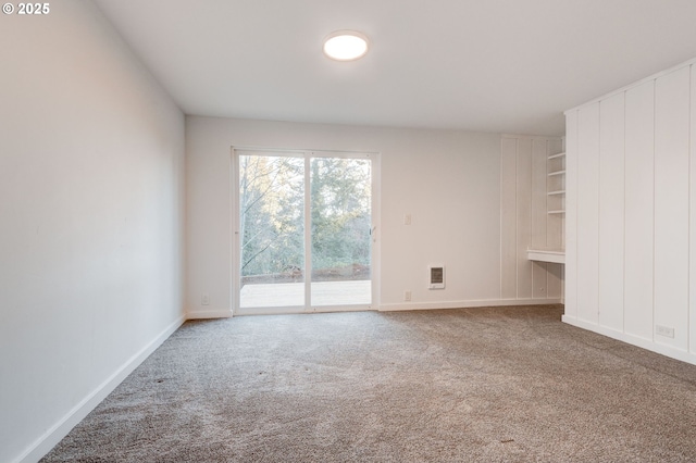 spare room featuring carpet floors