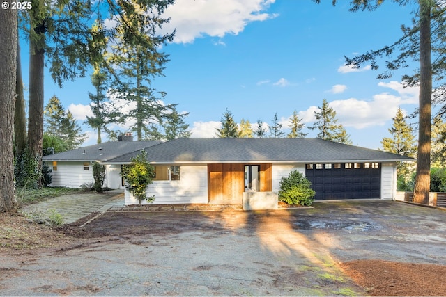 ranch-style home featuring a garage