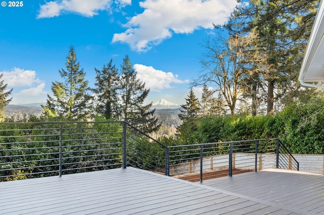 wooden deck featuring a mountain view