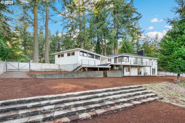 view of front of property with a wooden deck