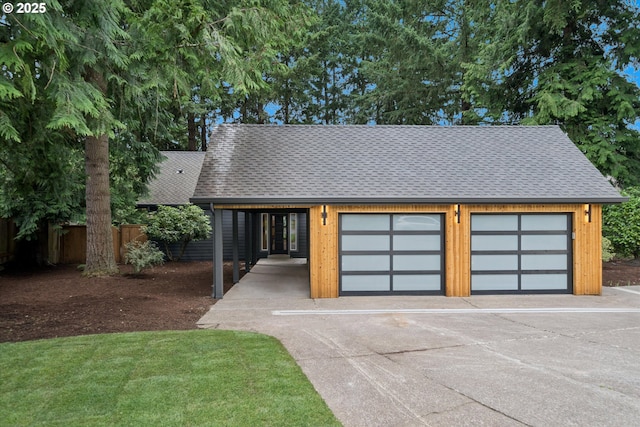 17253 SW Rivendell Dr, Portland, OR 97224 - view of front facade with roof with shingles and a garage