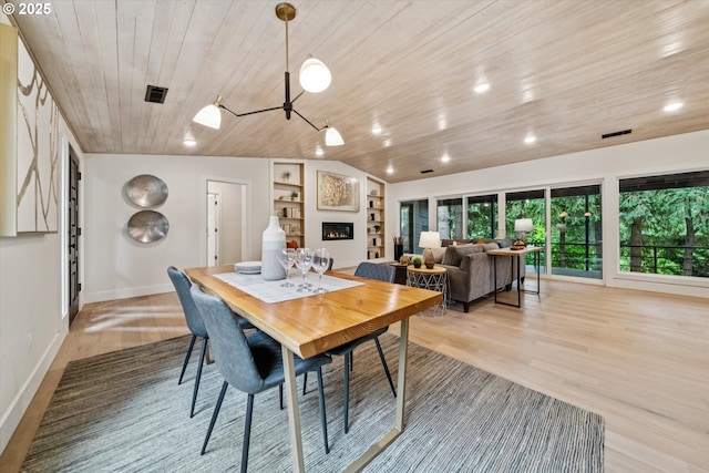 17253 SW Rivendell Dr, Portland, OR 97224 - dining space with wood ceiling, built in shelves, light wood-style flooring, and vaulted ceiling
